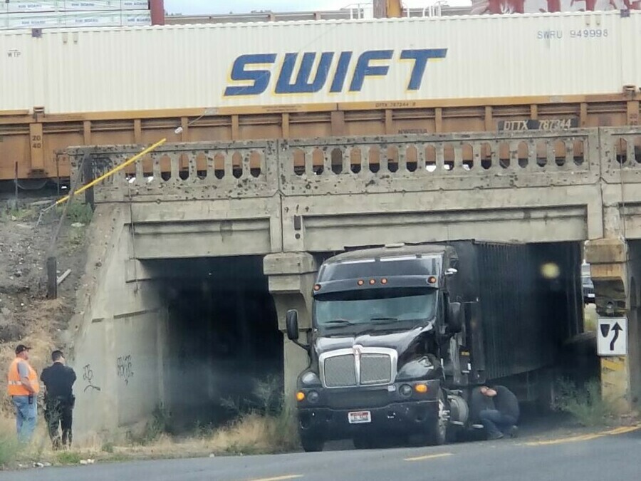 Semi-Truck Stuck under Bridge